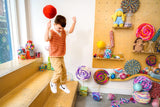 Kid holding jumbo lollipop craft jumping thumbnail