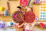 Kids holding jumbo lollipop decorations thumbnail