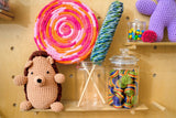 Lollipop decorations made with yarn surrounded by other candy jars and crochet patterns thumbnail