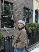 woman wearing a knit head warmer made with Hometown yarn thumbnail
