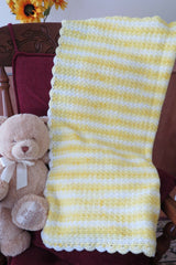 Crochet Blanket Beside A Teddy Bear thumbnail
