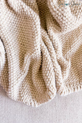 whipped cream colored knitted blanket highlighting seed stitch texture thumbnail