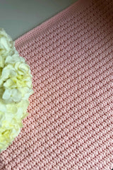 close-up of dusty rose waffle wave crocheted blanket thumbnail