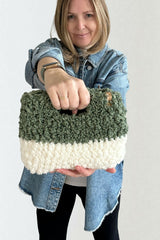 Woman holding sherpa bag thumbnail