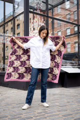 woman holding cat face blanket thumbnail