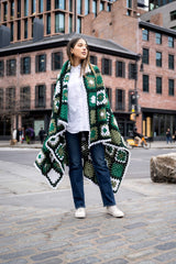 model wrapped in granny square blanket thumbnail