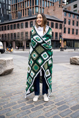 model wrapped in granny square blanket thumbnail