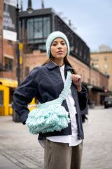 Crochet crossbody bag with tassels on a model thumbnail