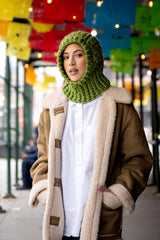 Woman in a granny square crochet hood thumbnail