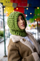 Woman in a granny square crochet hood thumbnail