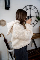 sideview of sweater with hood down thumbnail