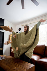 Girl wearing a crochet blanket/poncho thumbnail