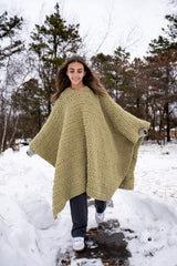 Girl wearing a crochet blanket/poncho in the snow thumbnail