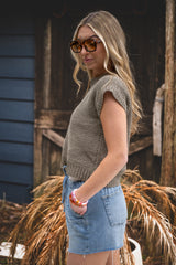 woman wearing a crochet top thumbnail