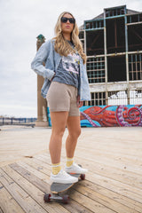 Woman wearing crochet shorts on a skateboard thumbnail