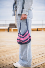 woman holding shoulder bag thumbnail