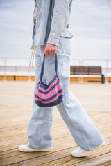 woman walking with shoulder bag thumbnail