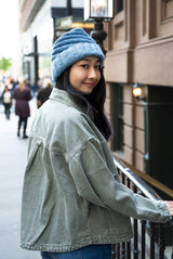 smiling woman wearing knit hat thumbnail