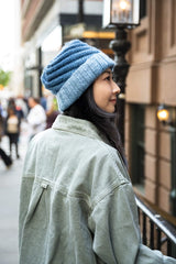 Side view of woman wearing knit hat thumbnail