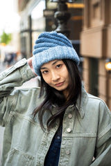 Woman wearing gradient knit hat thumbnail