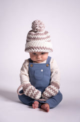 baby wearing crochet hat and mittens thumbnail