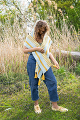 Woman wearing yellow and blue hooded scarf thumbnail