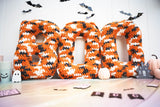 BOO crochet letters surrounded by other Halloween decor thumbnail