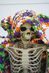 Crochet Halloween hooded blanket on a skeleton decoration thumbnail