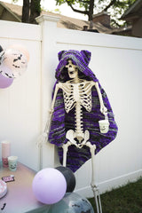 Knit Halloween theme blanket on a skeleton decoration thumbnail