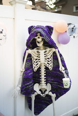 Knit Halloween theme blanket on a skeleton decoration thumbnail
