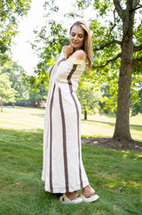 Cream and brown throw being held up by a woman  thumbnail