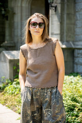 Woman wearing a brown knit top with crochet trim thumbnail