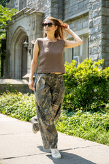Woman  wearing a brown knit top with crochet trim thumbnail