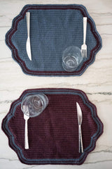 contrast color placemats on a table with cutlery and glasses on top  thumbnail