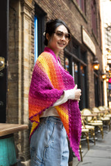 Side view of woman wearing triangle crochet shawl thumbnail
