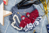 tassel earrings in jewelry dish thumbnail