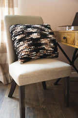 self striping pillow on a chair thumbnail