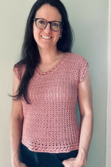 Woman in glasses wearing a crochet top thumbnail