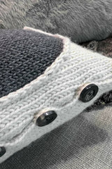 close up of pillow with a heart and 4 buttons on a couch thumbnail