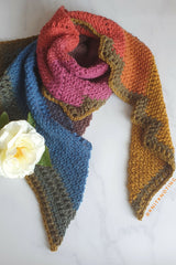 scarf on marble background with flower on top thumbnail