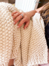 whipped cream colored knitted blanket highlighting seed stitch texture thumbnail