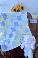 baby blanket draped over chair thumbnail