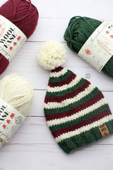 striped elf stocking cap with red, white, and green stripes and a white pom-pom thumbnail