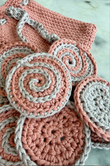 Crocheted face rounds with bag on counter thumbnail