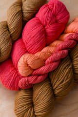 Image of multiple skeins of yarn in different hues, weights and textures. thumbnail