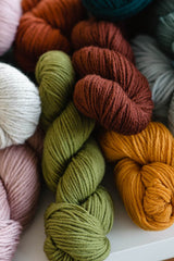Image of multiple skeins of yarn in different hues, weights and textures. thumbnail