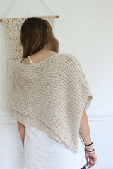 Knitted Poncho Worn By A Woman thumbnail