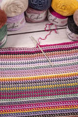 striped blanket crochet hook and coboo yarn balls thumbnail