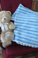 Crochet Blanket Beside A Teddy Bear thumbnail