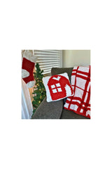 Crochet Stocking Hanged Beside A Couch thumbnail